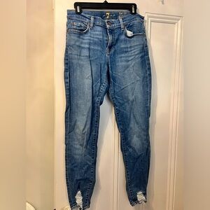 Blue skinny jeans with pre distressed ankles